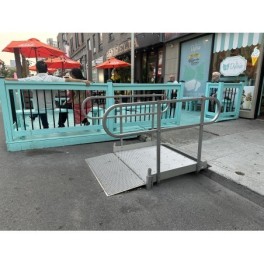 Wheelchair ramp with handrails
