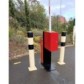 Support bracket for retractable barrier reel with signaling belt