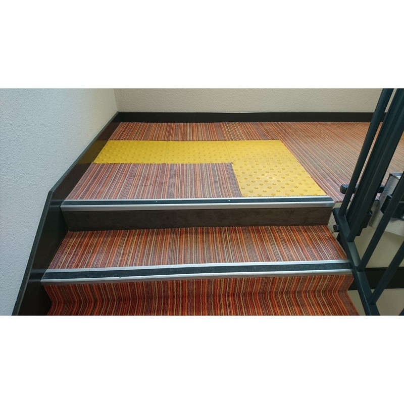 Tactile paving slab with studs